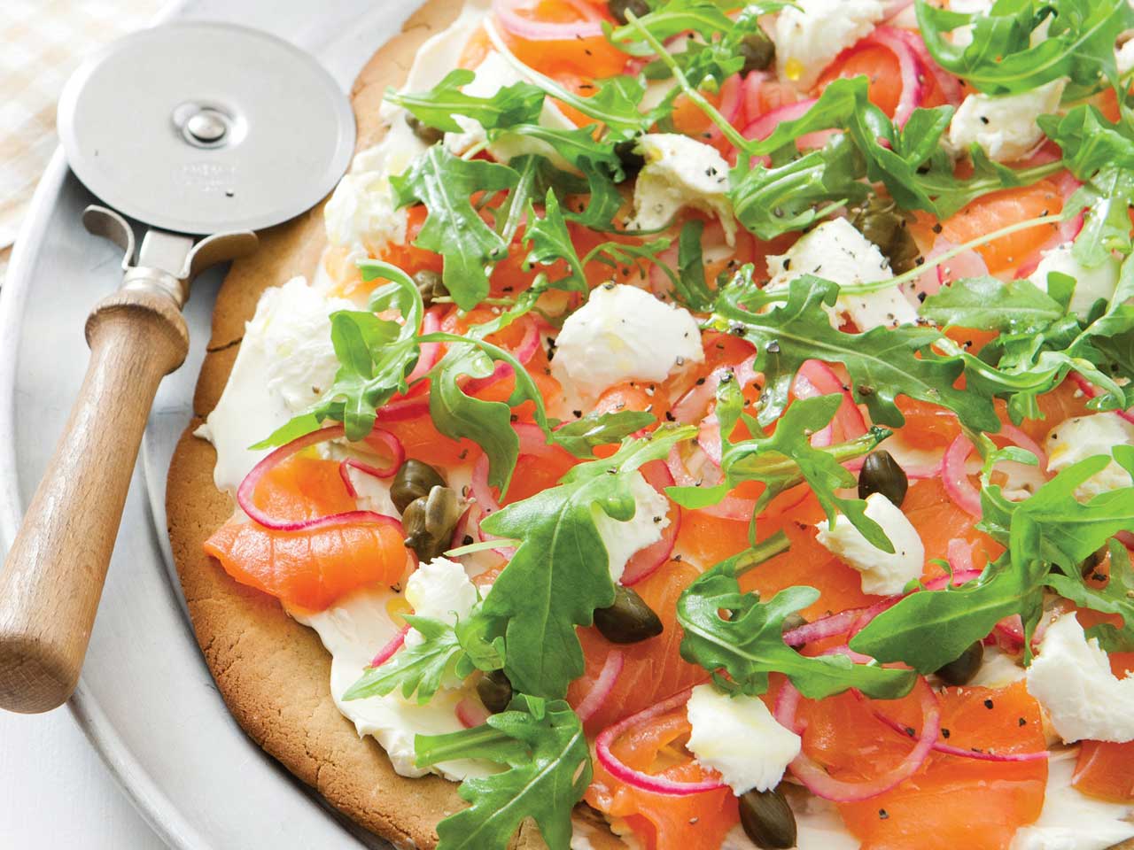 Gluten free quinoa pizza with smoked salmon