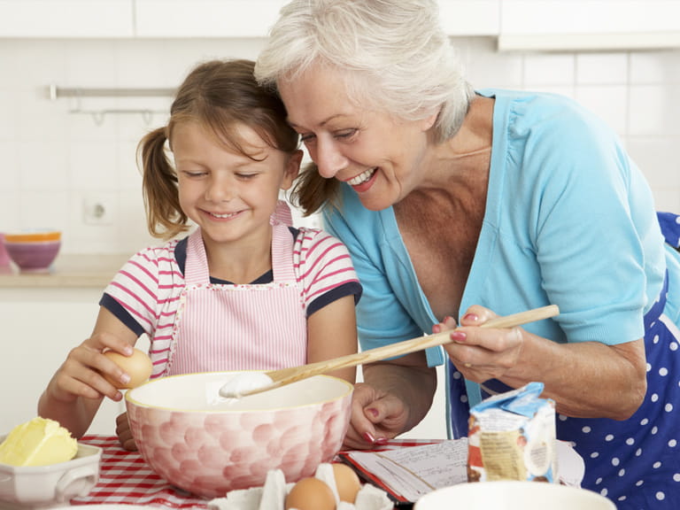 Grandmother baking with child