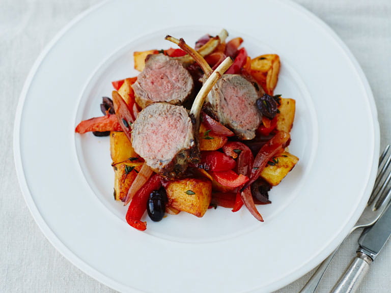 Lamb cutlets with roast King Edward potatoes, smoked paprika, peppers, onions and olives