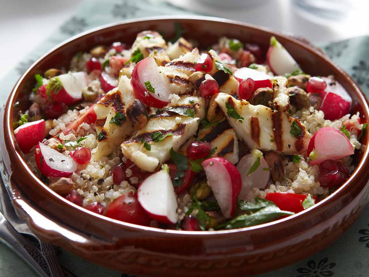 Radish and quinoa tabouleh with pistachios and grilled, herbed halloumi 