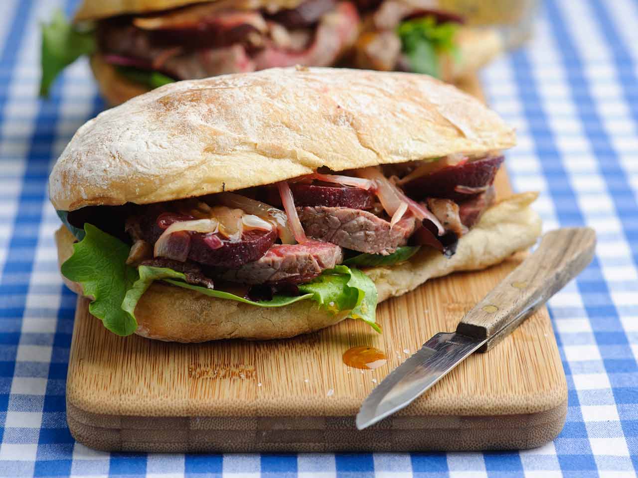 Warm steak and beetroot sandwich with honey and mustard dressing 