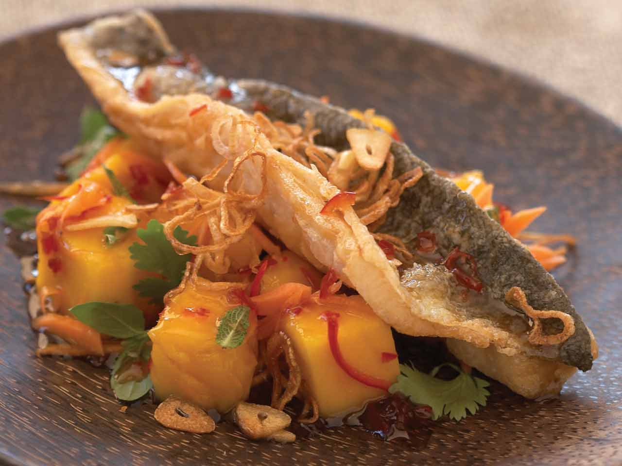Crisp-fried sea bass in sweet chilli sauce, with mango and mint salad