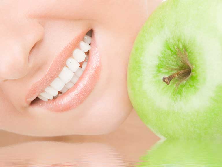 Healthy teeth and an apple