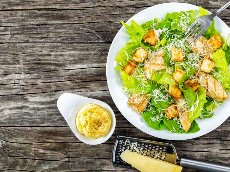 Caesar salad with grated cheese and mayonnaise