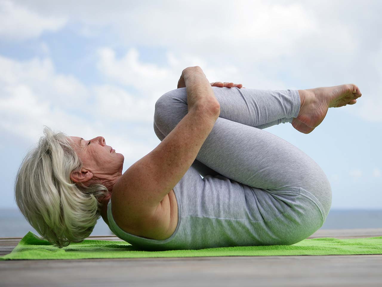 Older woman in yoga pose