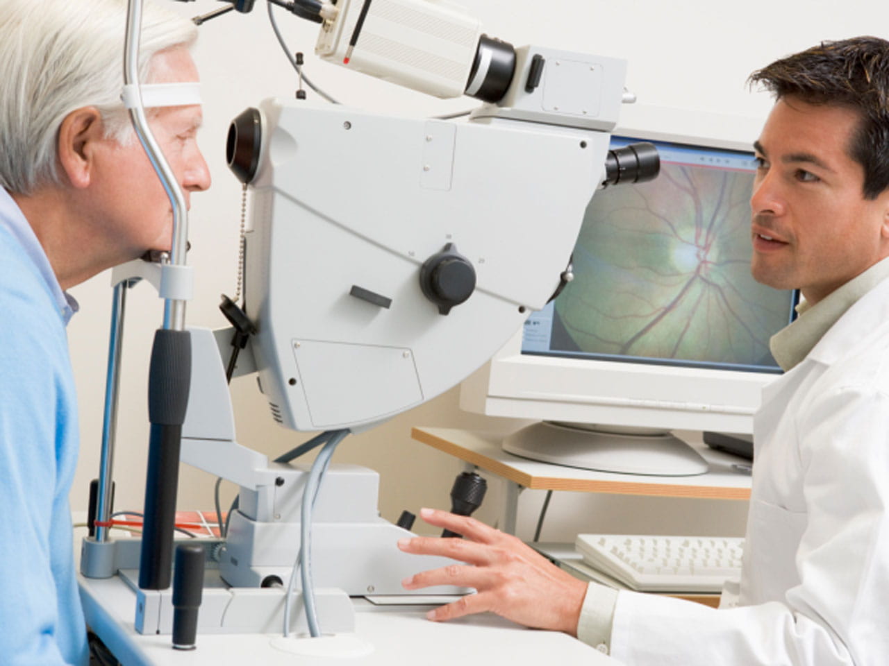 Optometrist examining a patient's eyes