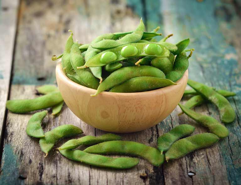 Soya foods, like these green soy beans, may help ease menopause symptoms