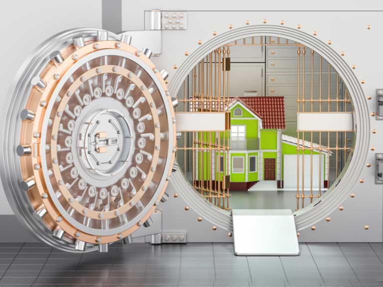 Unlocked bank vault with a house inside