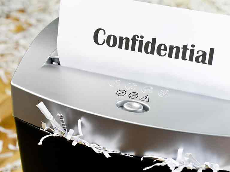 Shredding confidential paperwork