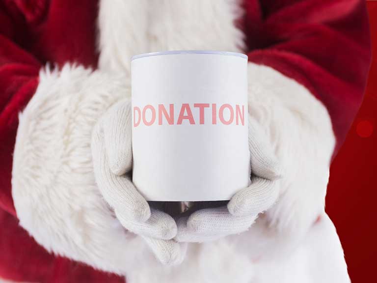 Santa with a charity collection tin at Christmas