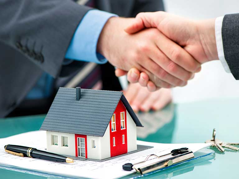 A buy-to-let mortgage is completed with a handshake