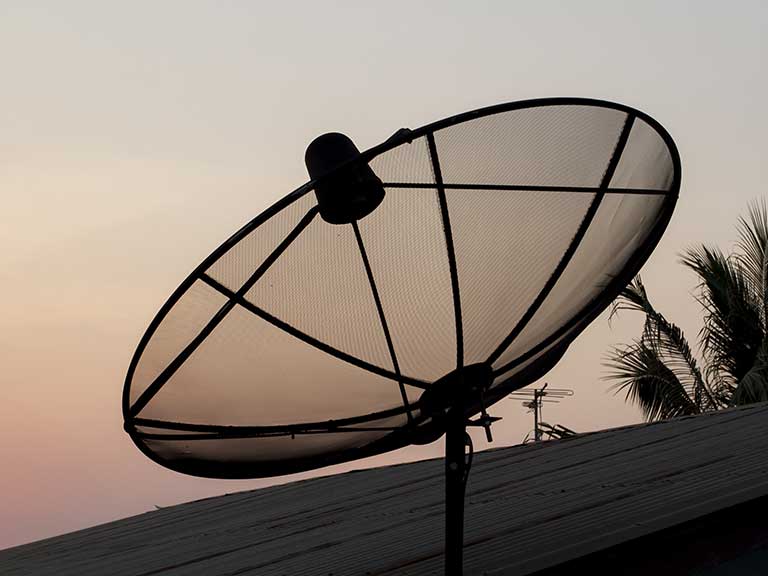 A satellite dish pointing to the sky for better TV reception