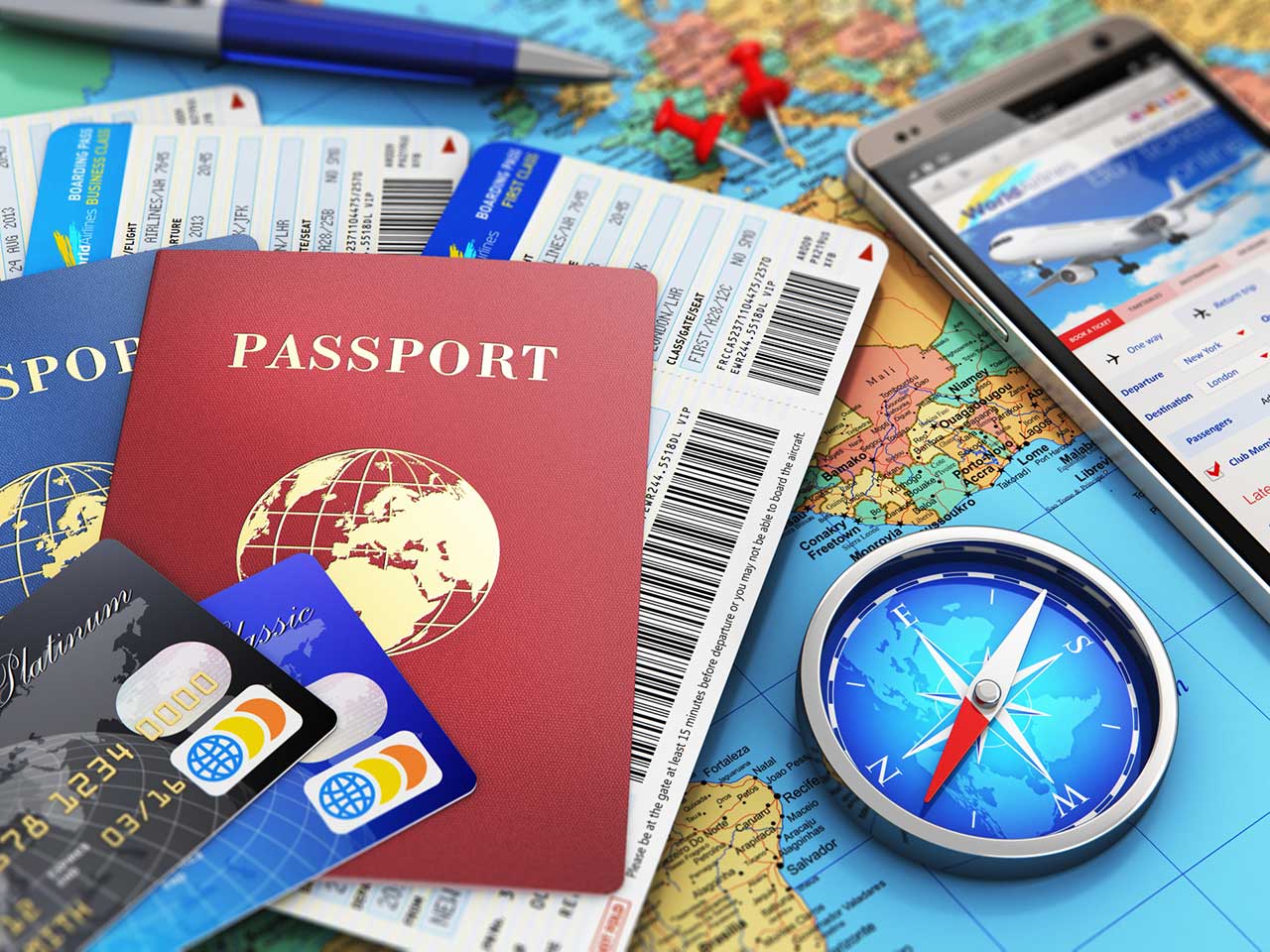 Passports, travel tickets, maps, credit cards and travel apps