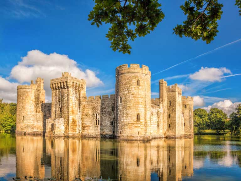 Medieval Bodiam Castle surrounded by a water-filled moat