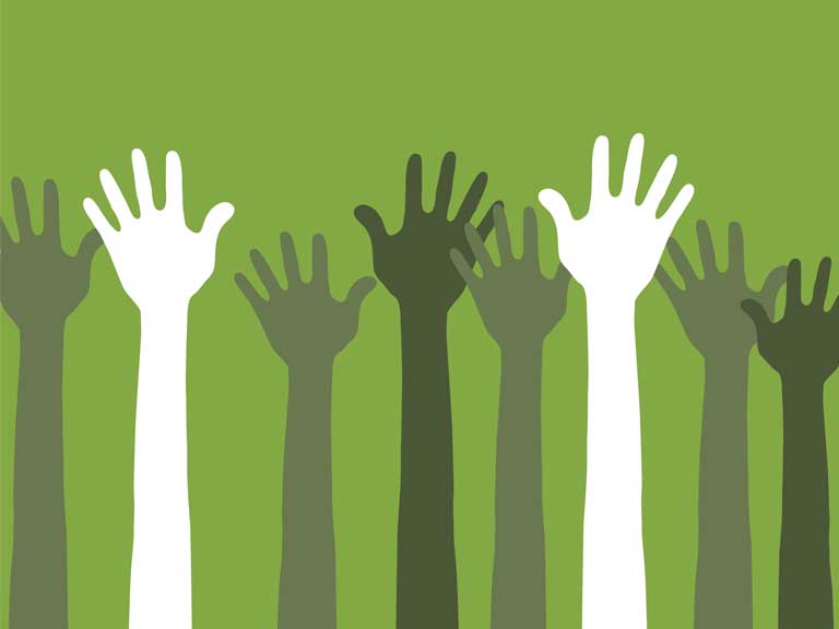 Hands raised to represent community and helping your peers