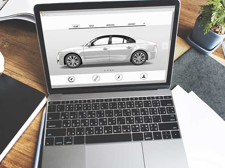 A laptop open on a car buying website