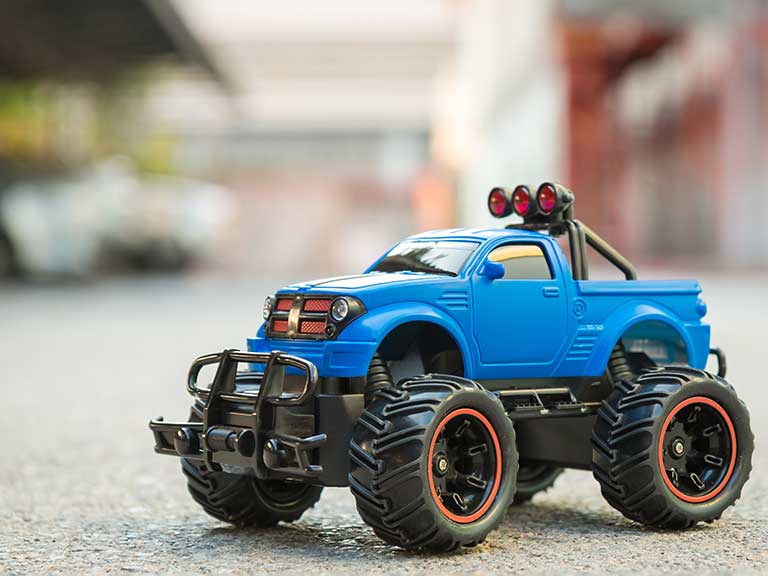 A remote control monster truck to represent how cars are getting larger
