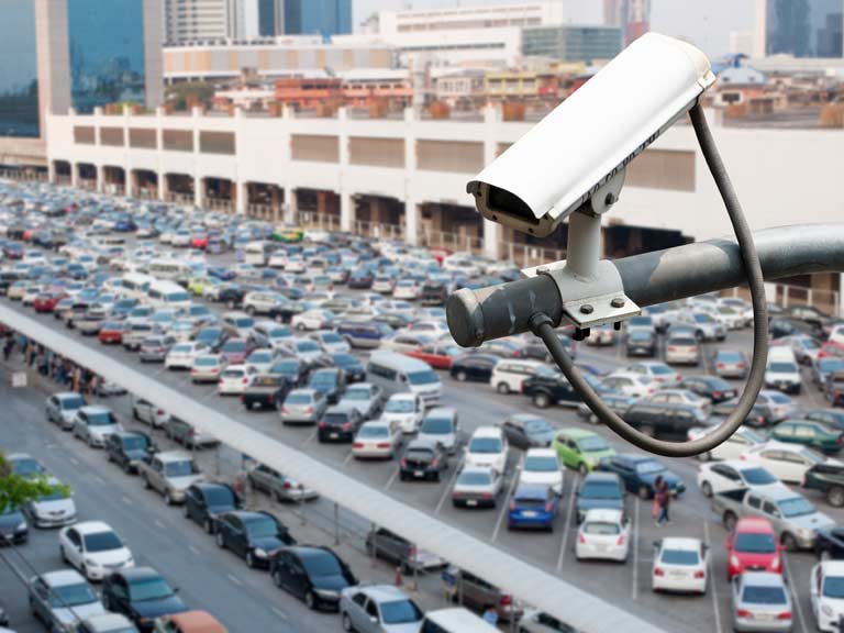 Parked cars being watched by CCTV cameras