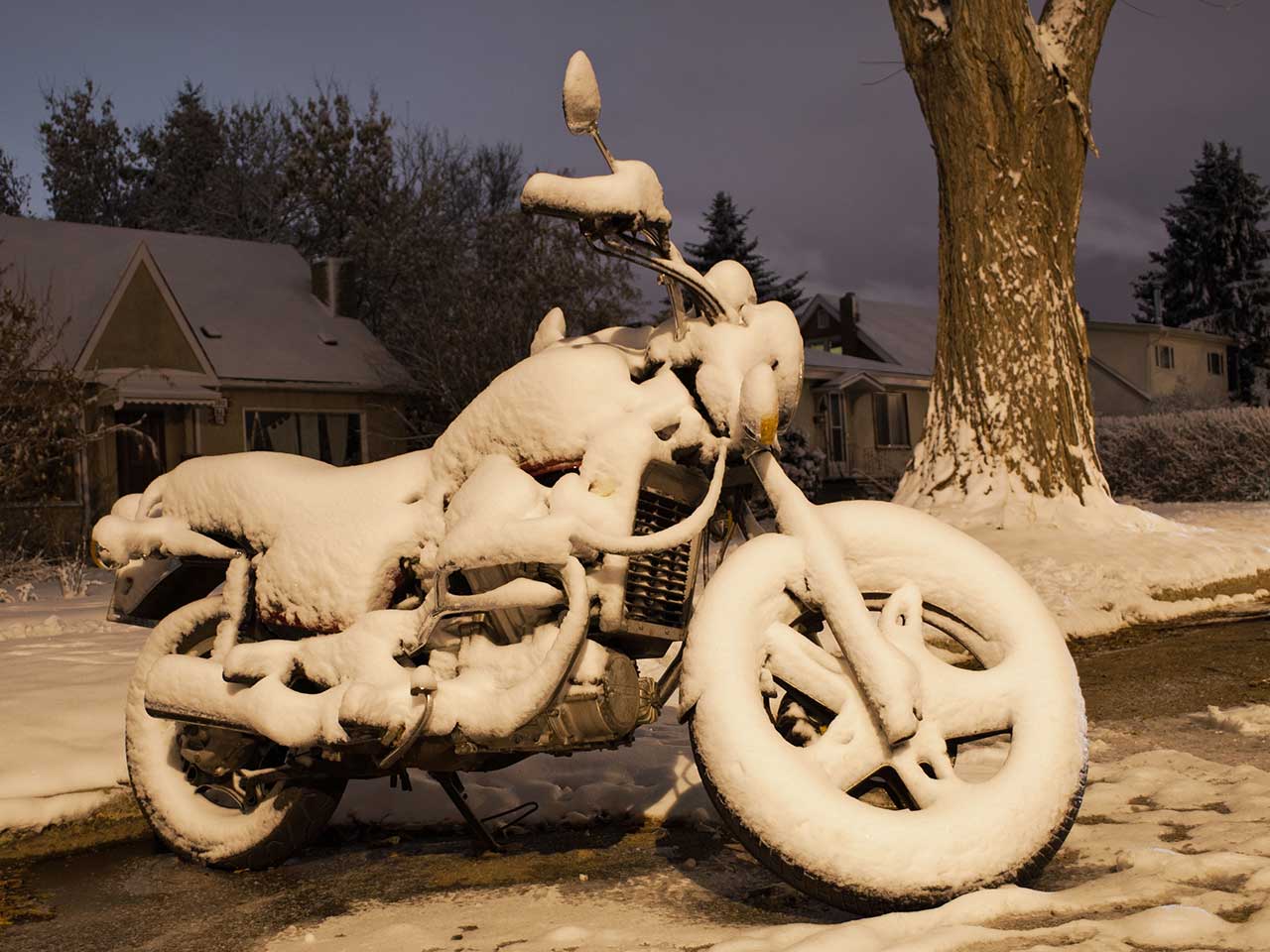 Motorbike covered in snow during the Winter