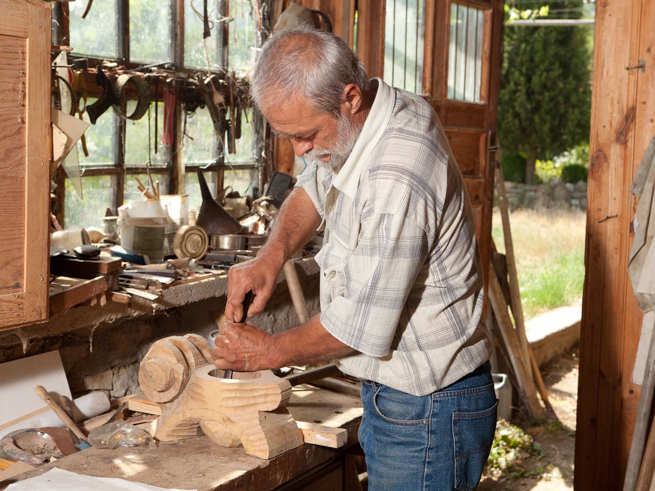 Retired man doing woodwork