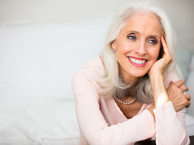 A beautiful older lady with naturally grey hair