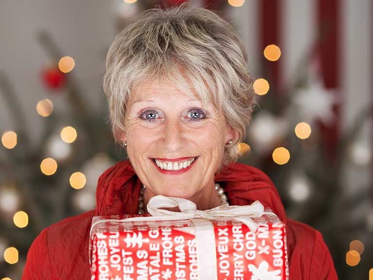 An older woman looks beautiful at Christmas
