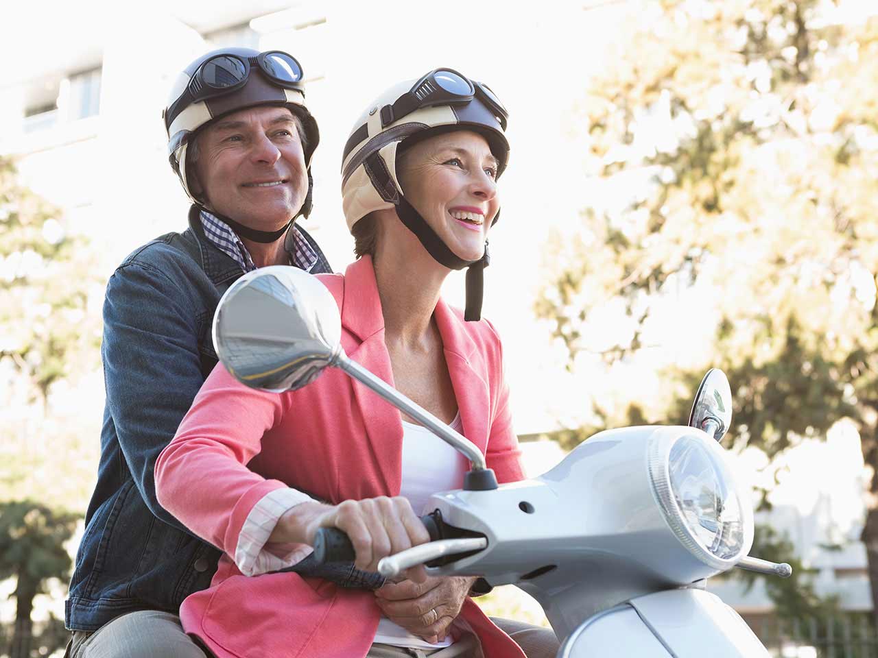 Mature couple on moped