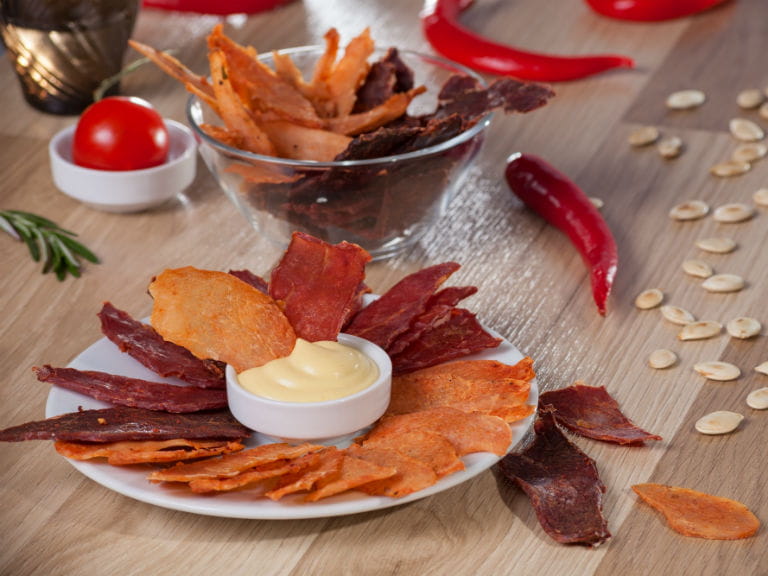 A platter of Biltong and homemade crisps, served with mayonnaise