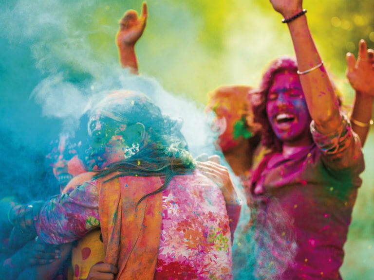 Two people celebrating Holi, the festival of colours