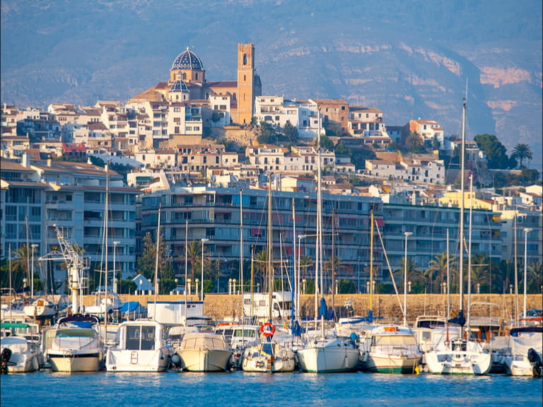 With its restaurants and Old Town packed with Spanish tourist attractions, Altea is one of the best places to visit in Spain - a view of the city taken from the Mediterrean sea