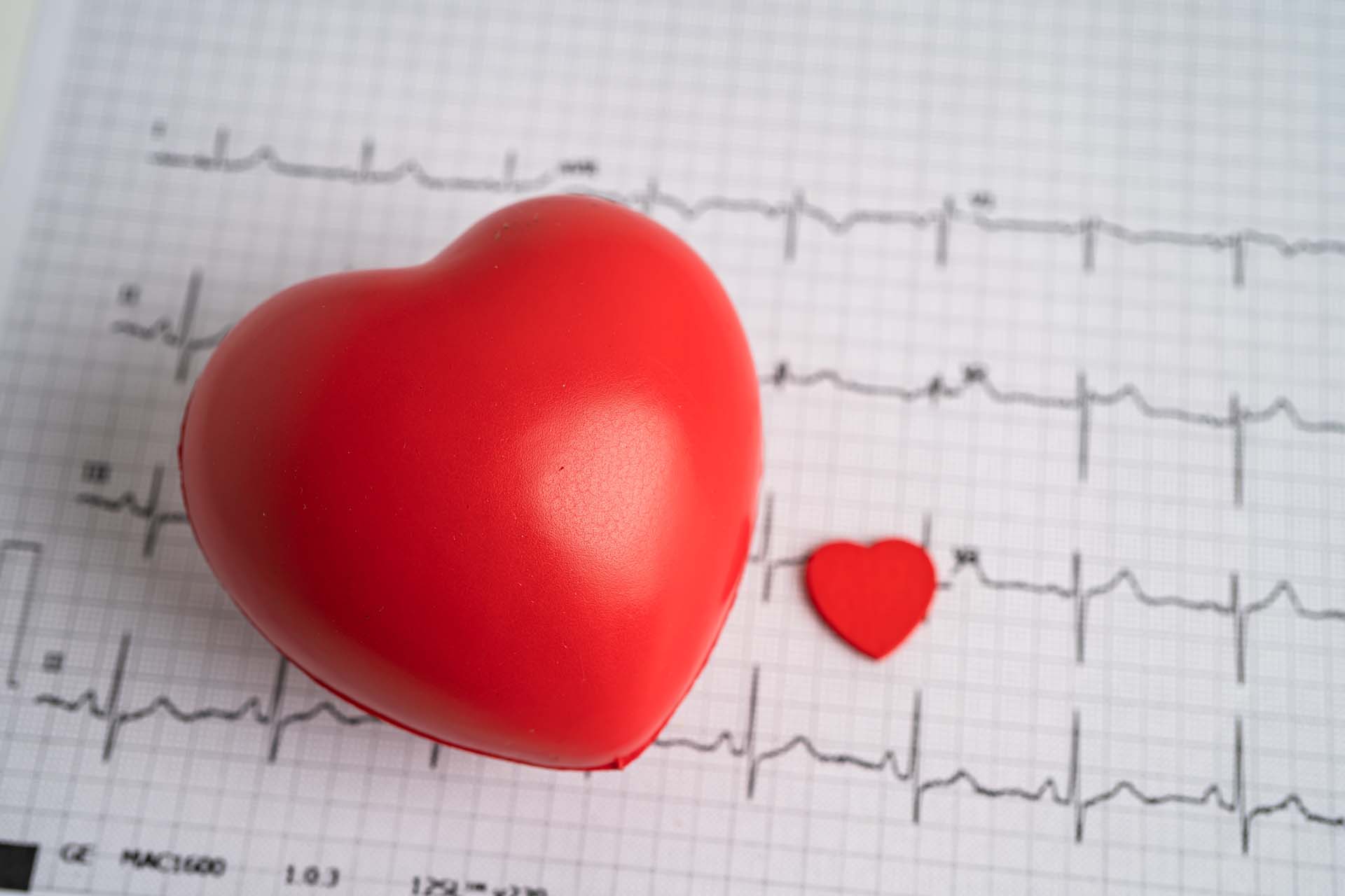 A red heart on a read out from an ECG scan showing heart rhythm