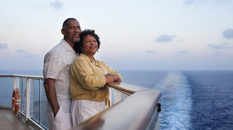 A smartly dressed couple enojoying a cruise