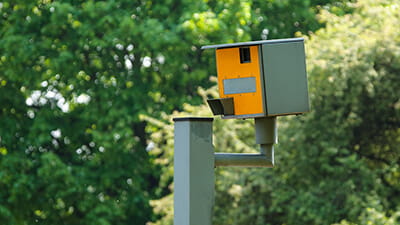 A speed camera in a leafy suburb