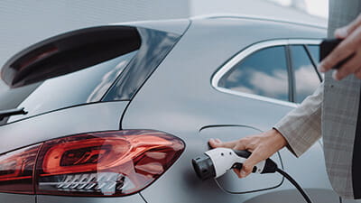 Close up of a car charger about to be plugged in