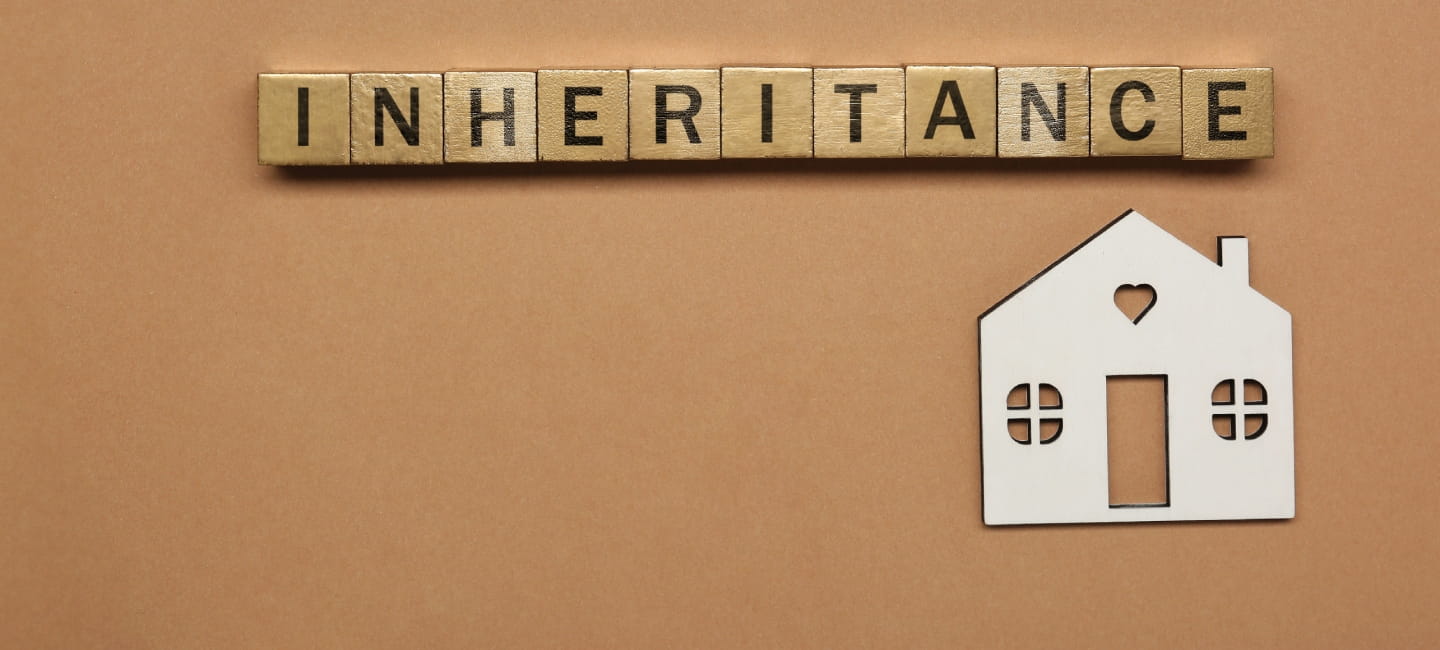 Scrabble pieces which spell out the word Inheritance 