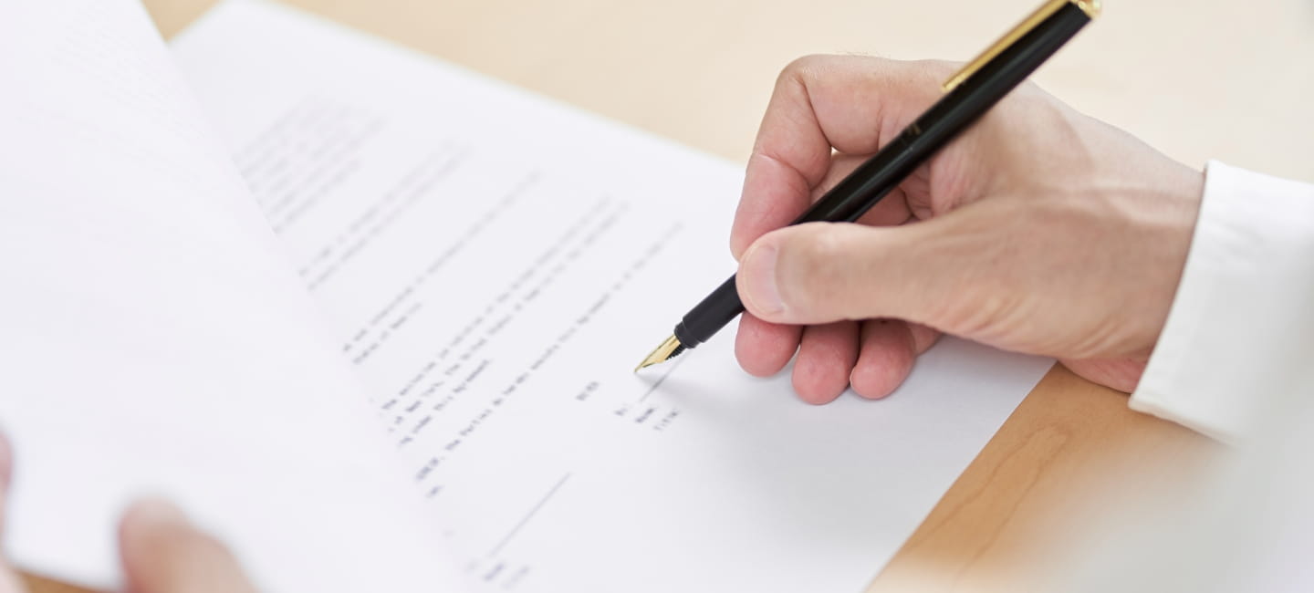 A person signing an official document