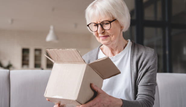 A woman opening a parcel