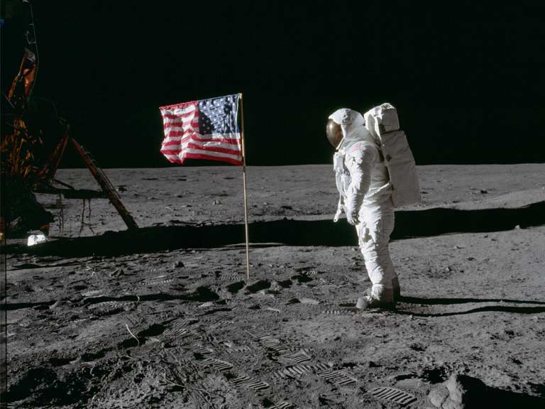 Astronaut Edwin E. 'Buzz' Aldrin Jr beside the US flag on the lunar surface
