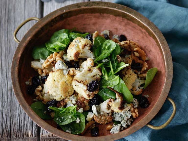 Roast cauliflower, spinach and blue cheese salad with cherries and walnuts