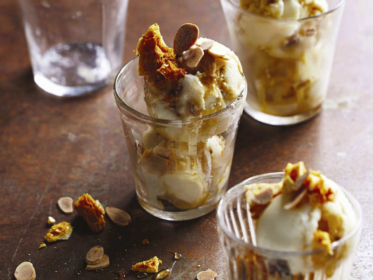 Honey ice cream with honeycomb and toated almonds