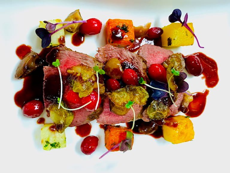 Roast Highland loin of venison with marinated blackberries