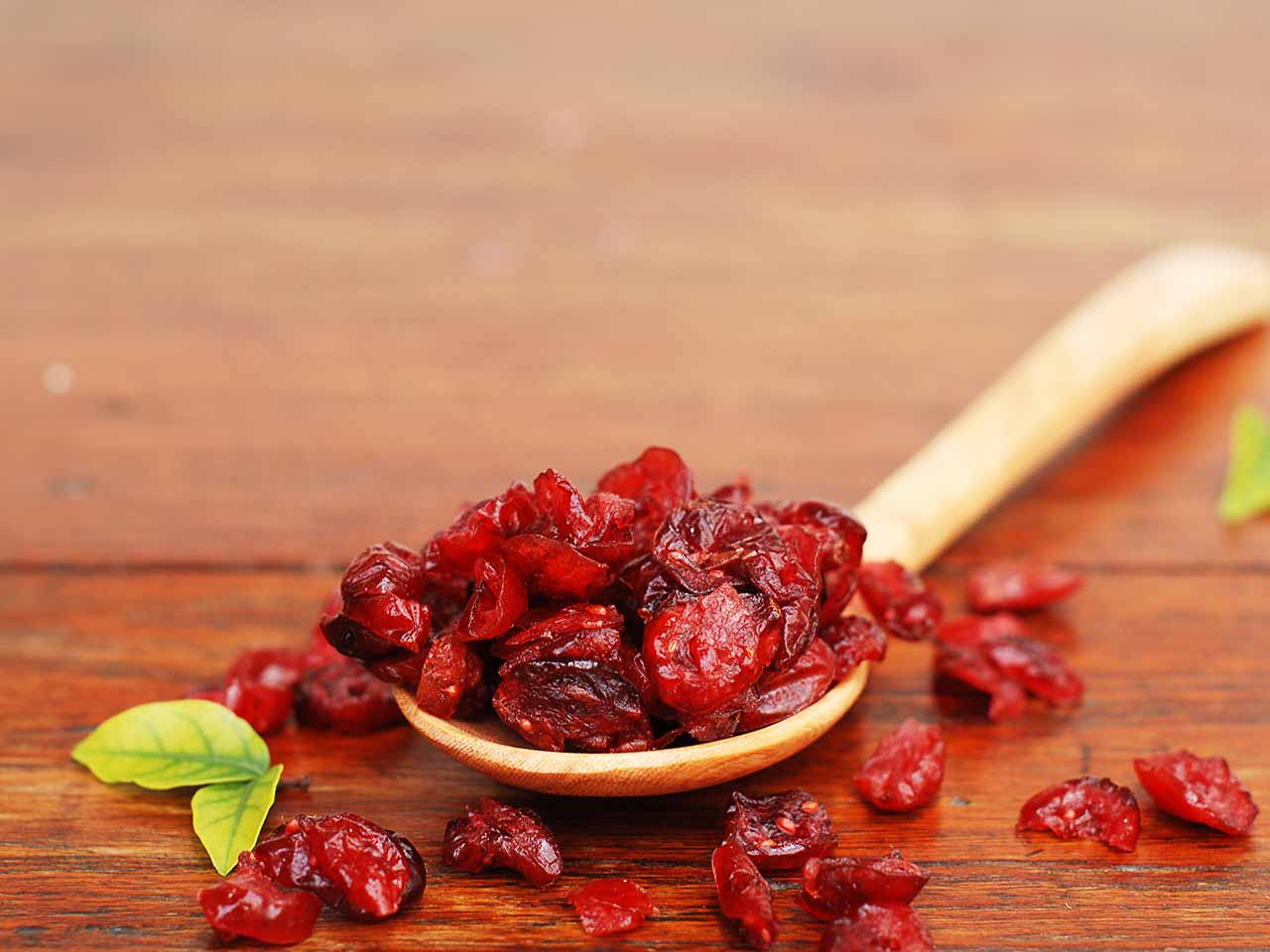 Dried cranberries on a spoon