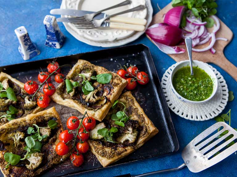 Red onion tart with watercress pesto and roasted cherry tomatoes