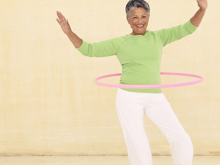 Senior woman hula hooping