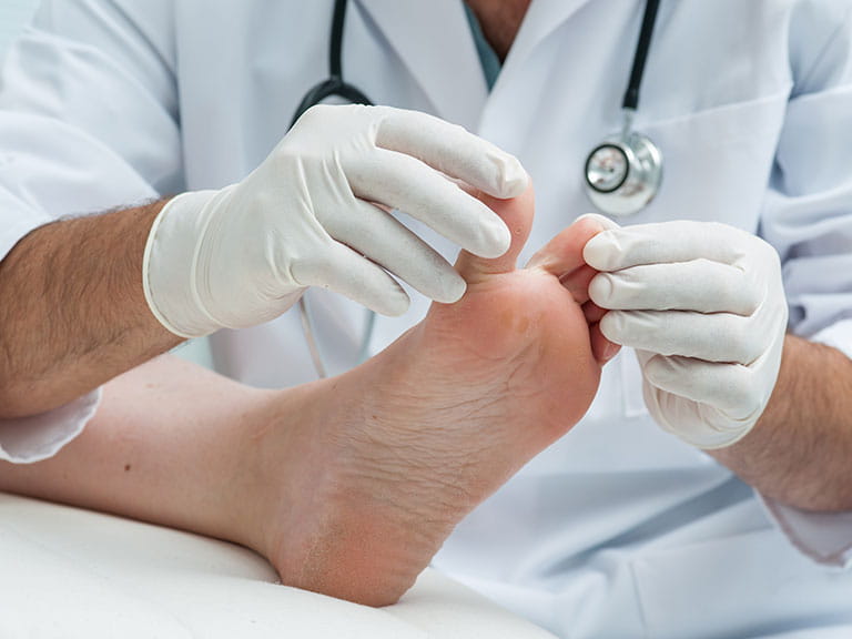 Doctor examining patient's foot