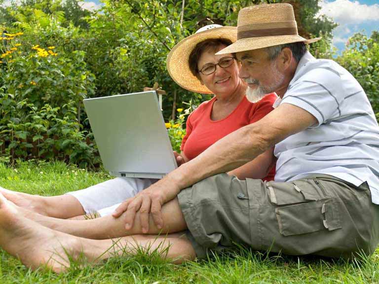 Couple designing a garden on a computer