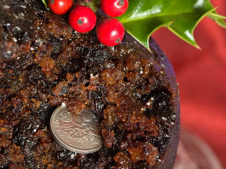 The traditional silver sixpence in a festive Christmas pud