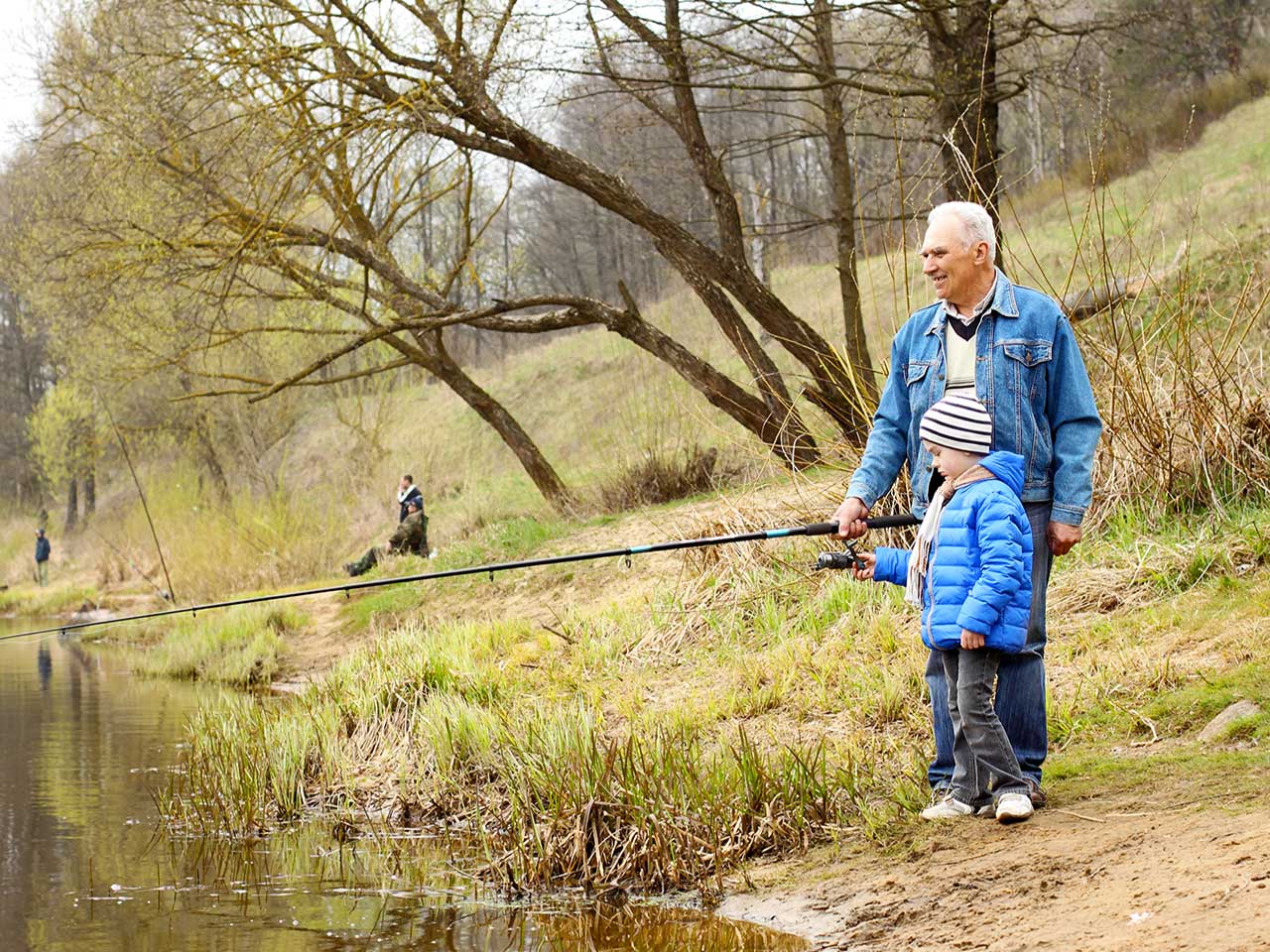 Man fishing with his grandson