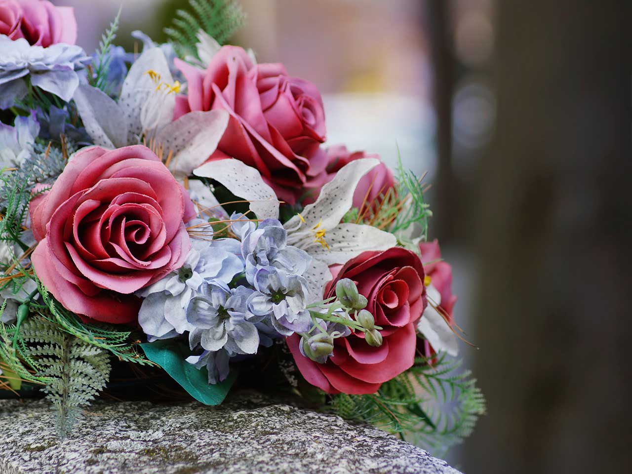 Funeral flowers resting on a gravestone