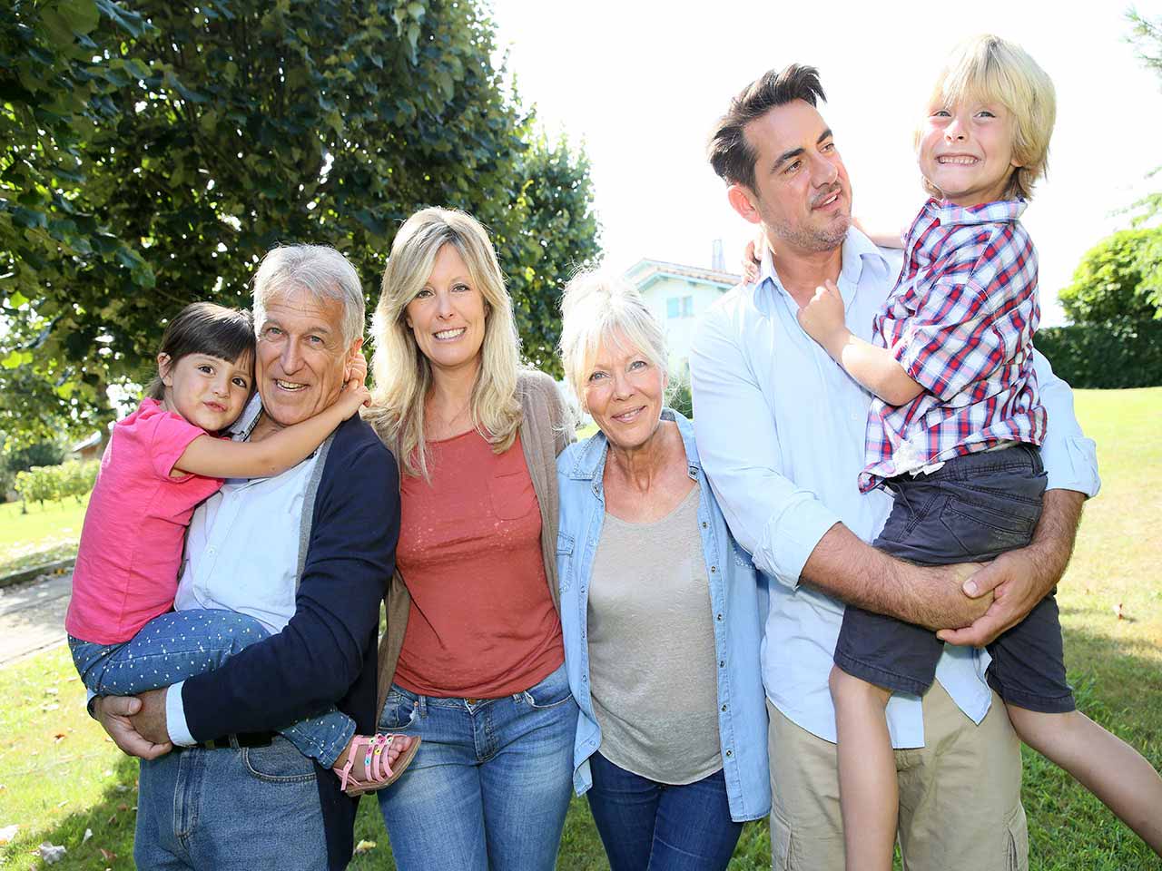Mature couple with their children and grandchildren